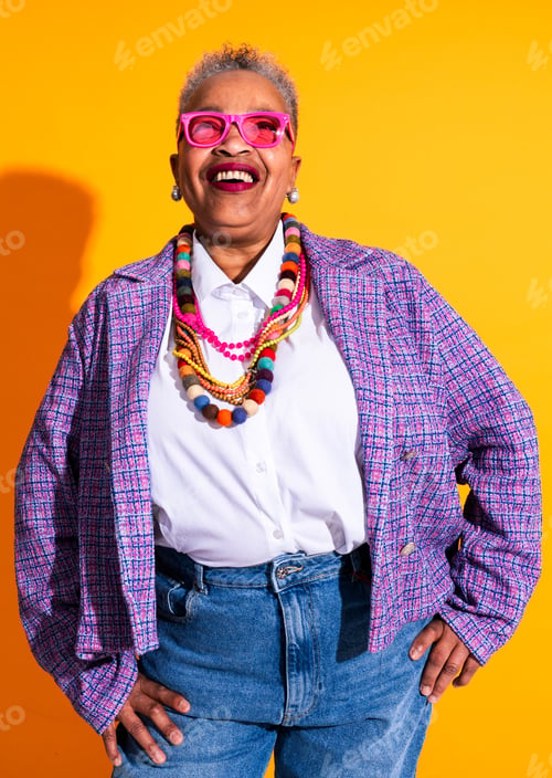 Preview: Mature woman smiling wearing colorful fashion clothing