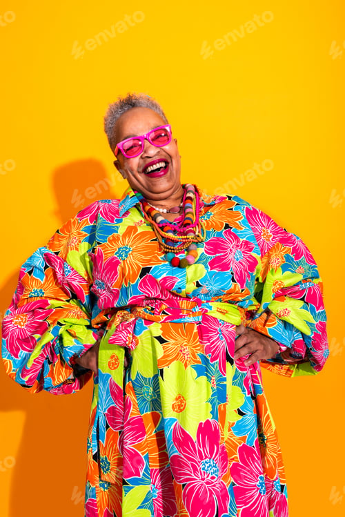 Preview: Happy senior woman laughing with colorful floral dress