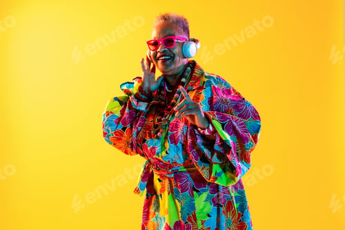 Preview: Senior woman enjoying music, vibrant lifestyle, and happiness