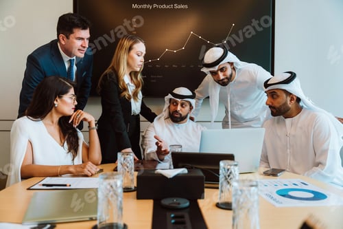 Preview: Diverse business team collaborating on project during meeting