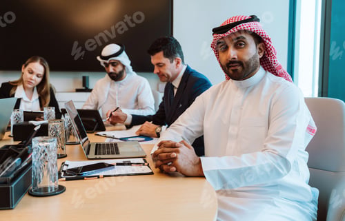 Preview: Arab businessman leading diverse corporate meeting