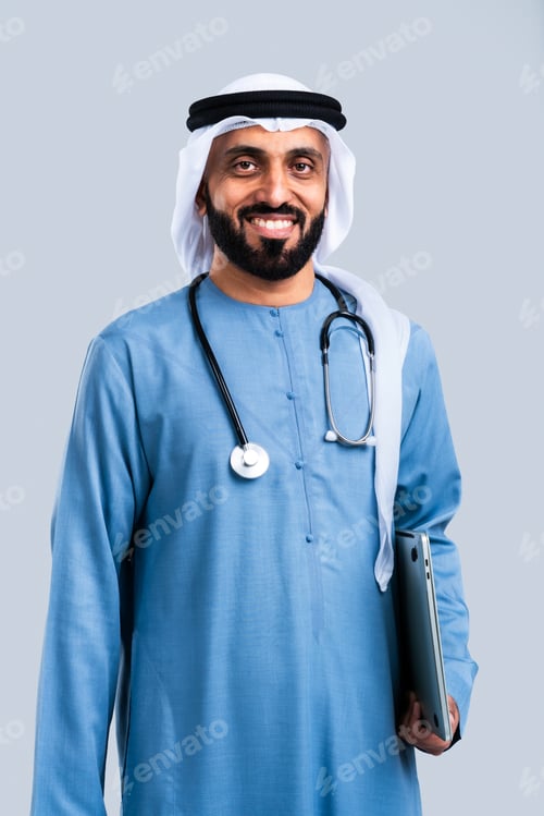 Preview: Smiling middle eastern doctor wearing traditional clothing holding laptop