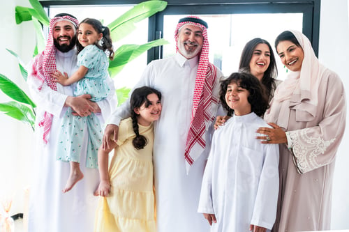 Preview: Arab family with parents and children celebrating togetherness at home