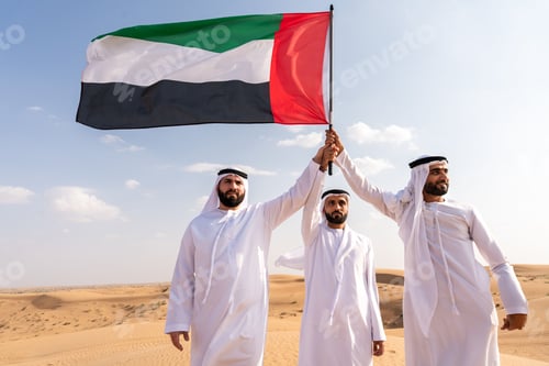 Preview: Emirati men bonding in dubai desert raising flag