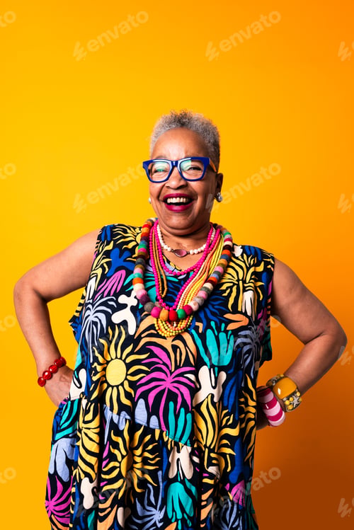 Preview: Smiling senior black woman posing with vibrant style