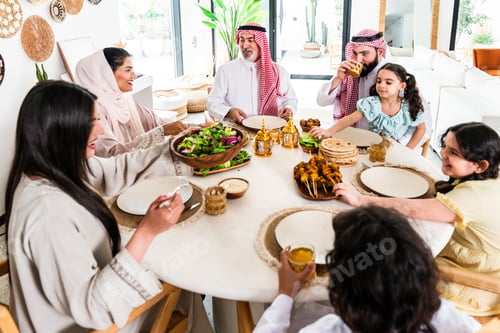 Preview: Arab family enjoying traditional meal together at home
