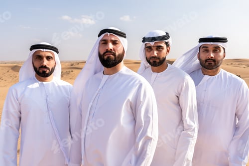 Preview: Arab men wearing emirati kandura bonding in dubai desert