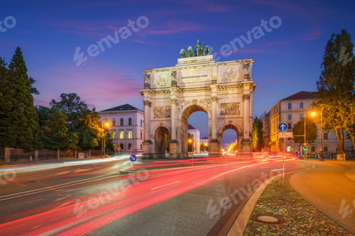 Preview: Munich Siegestor Victory Gate at night with vibrant traffic light trails