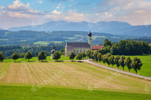 Preview: Irschenberg pilgrimage church Wilparting under cloudy sky in Bavaria Germany