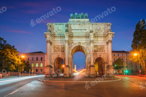 Preview: Illuminated Siegestor Victory Gate at blue hour with traffic light trails