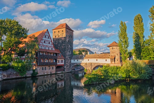 Preview: Pegnitz river and Henkersteg bridge with half timbered houses Nuremberg dusk