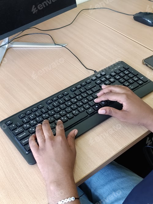 Preview: A Young Black Woman, a University Student Working at a Computer