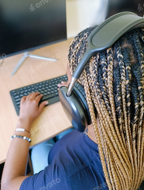 Preview: A Young Black Woman, a University Student Working at a Computer