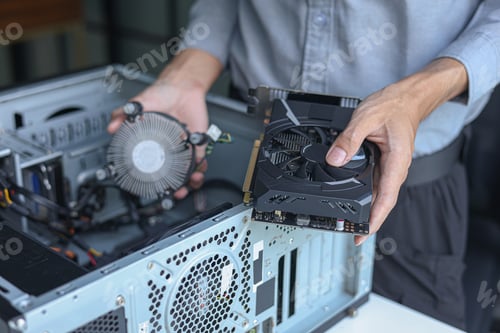 Preview: Close up of electronic technician hands working on computer repair.