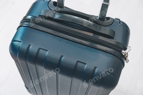 Preview: Hard-shell suitcase with textured surface and zipper details viewed from above