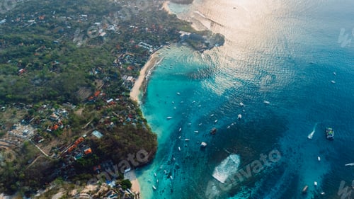Preview: Turquoise bay and tropical coastline from drone at sunset