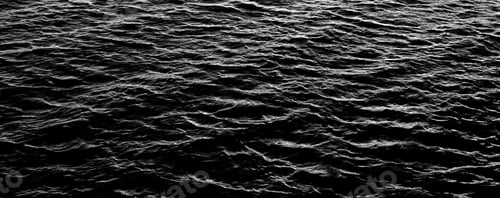 Preview: Black and white sea water texture with dramatic lighting. Contrasting ocean waves pattern.