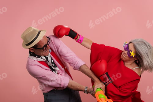Preview: Older couple acting playful celebrating active maturity