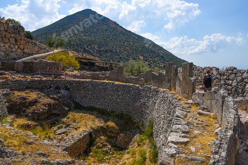 Preview: Mycenae ancient ruins with visitor exploring historical site