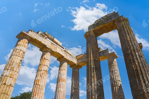 Preview: Temple of Zeus columns standing against blue sky in Nemea