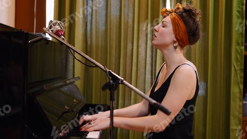 Preview: Passionate Woman Playing Piano and Singing Into a Microphone