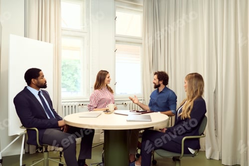 Preview: Professionals Collaborating in a Formal Business Meeting Around an Office Table