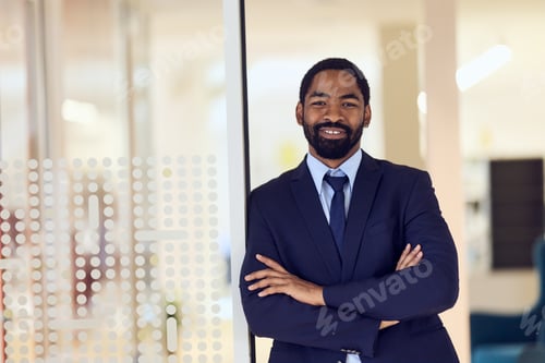 Preview: Confident African-American Businessman Smiling in Modern Office Environment