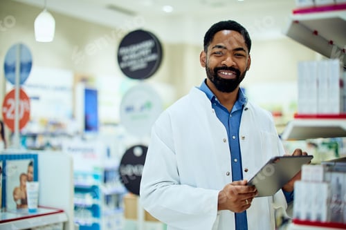 Preview: Smiling Pharmacist Holding Tablet in Modern Pharmacy Store