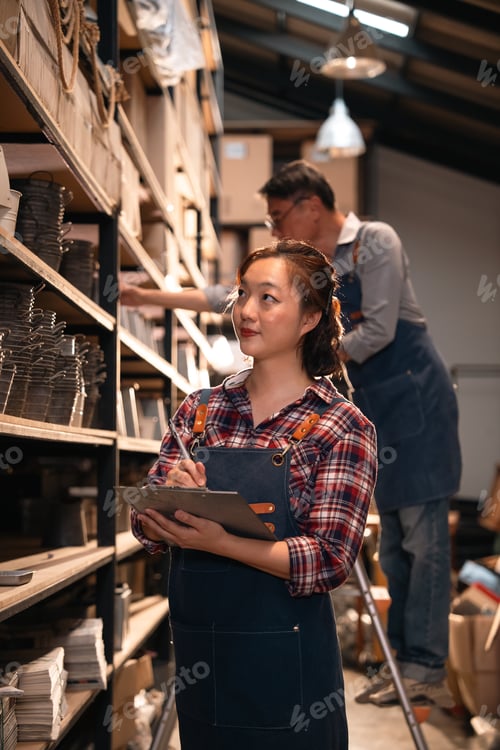 Preview: Warehouse inventory inspection in workshop, woman with clipboard, shelves, storage, worker