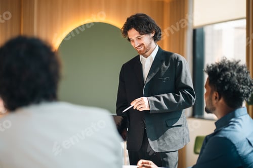 Preview: Business meeting, smiling man, suit jacket, presentation, office interior