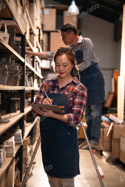 Preview: Clothing store inventory work in warehouse, female worker and male worker