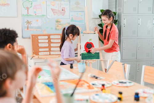 Preview: Art class, child, teacher, painting, classroom activity with easel and smiling student