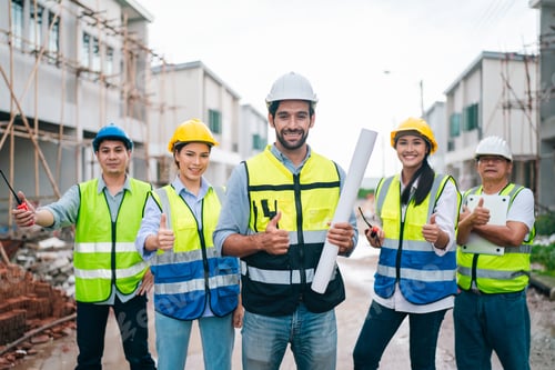 Preview: Construction team in hard hat giving thumbs up