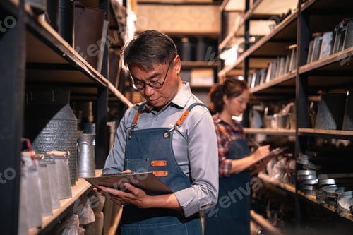 Preview: Inventory check in warehouse aisle, two worker on stock shelf