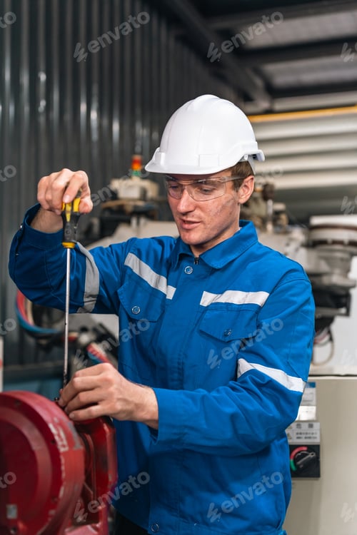 Preview: Industrial worker repairing machine