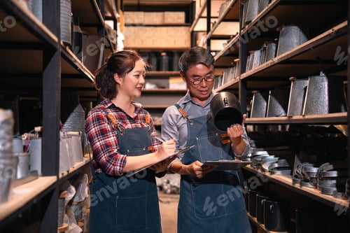 Preview: Workshop shelf inventory with worker and colleague in storage room