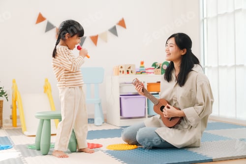 Preview: Girl, woman, ukulele, microphone, playtime, smiling in bright playroom