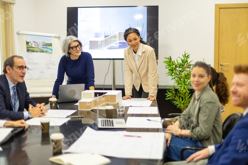 Preview: Architecture team discussing project in meeting room