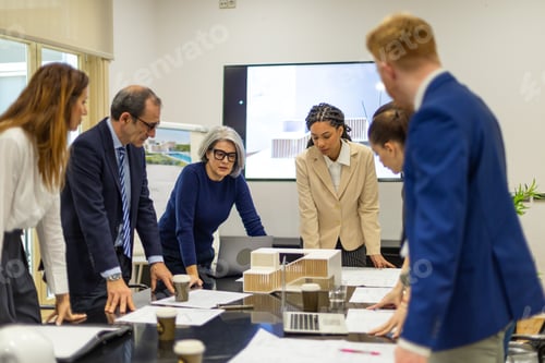 Preview: Architects collaborating on new building design plans