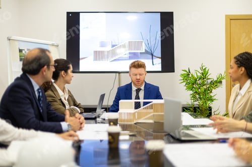 Preview: Architects discussing building design project in meeting room