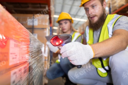 Preview: Warehouse workers scanning barcode with tablet in distribution center. Logistics team checking inven