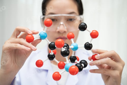 Preview: Scientist holding molecular model for chemical technology.