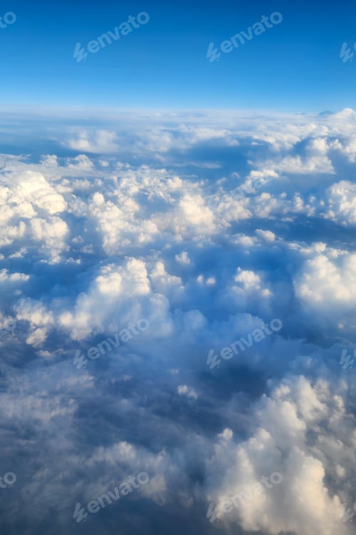 Preview: Blue sky viewing fluffy clouds from above