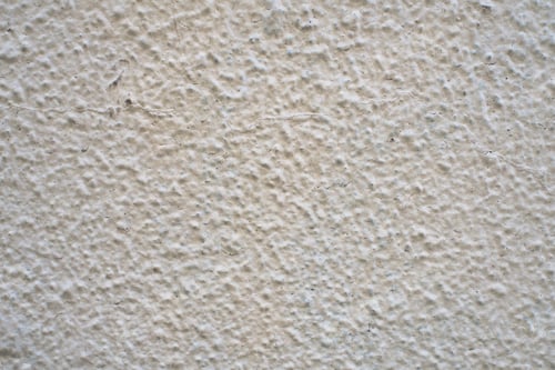 Preview: Bumpy white wall texture creating durable background