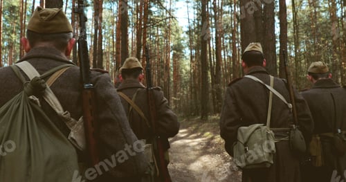 Preview: Squad Men Dressed As World War II Russian Soviet Red Army Soldiers Marching Through Spring Fores...