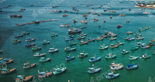 Preview: Fishing boats, coastal harbor, turquoise water, aerial view