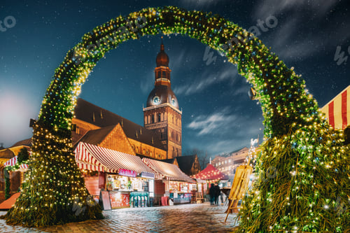 Preview: Riga, Latvia. Traditional Christmas Market On Dome Square With Cathedral. Famous Landmark In Win...