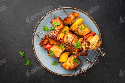 Preview: Grilled shish kebab or meat skewers with vegetables.