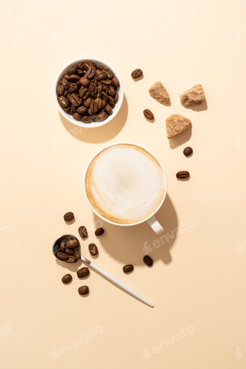 Preview: Cappuccino cup and roasted coffee at colored background.