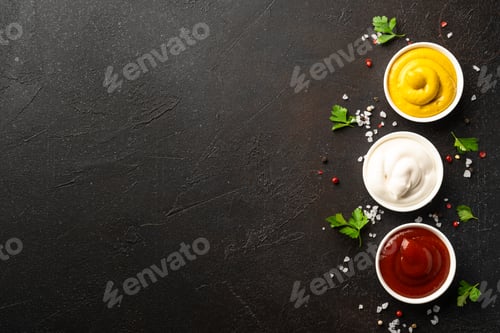 Preview: Sauce bowls - mayonnaise, mustard, ketchup on black background.